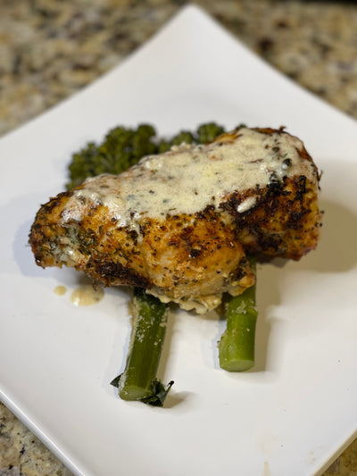 Air Fried Cajun Stuffed Chicken Breast w/Cajun Cream Sauce over Broccolini